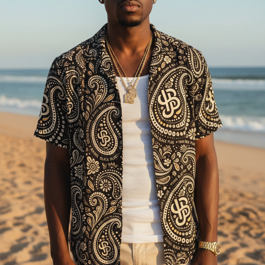 Man wearing a patterned shirt on a beach YBP Cocktails Collection button up shirt lightweight summer paisley camp shirt